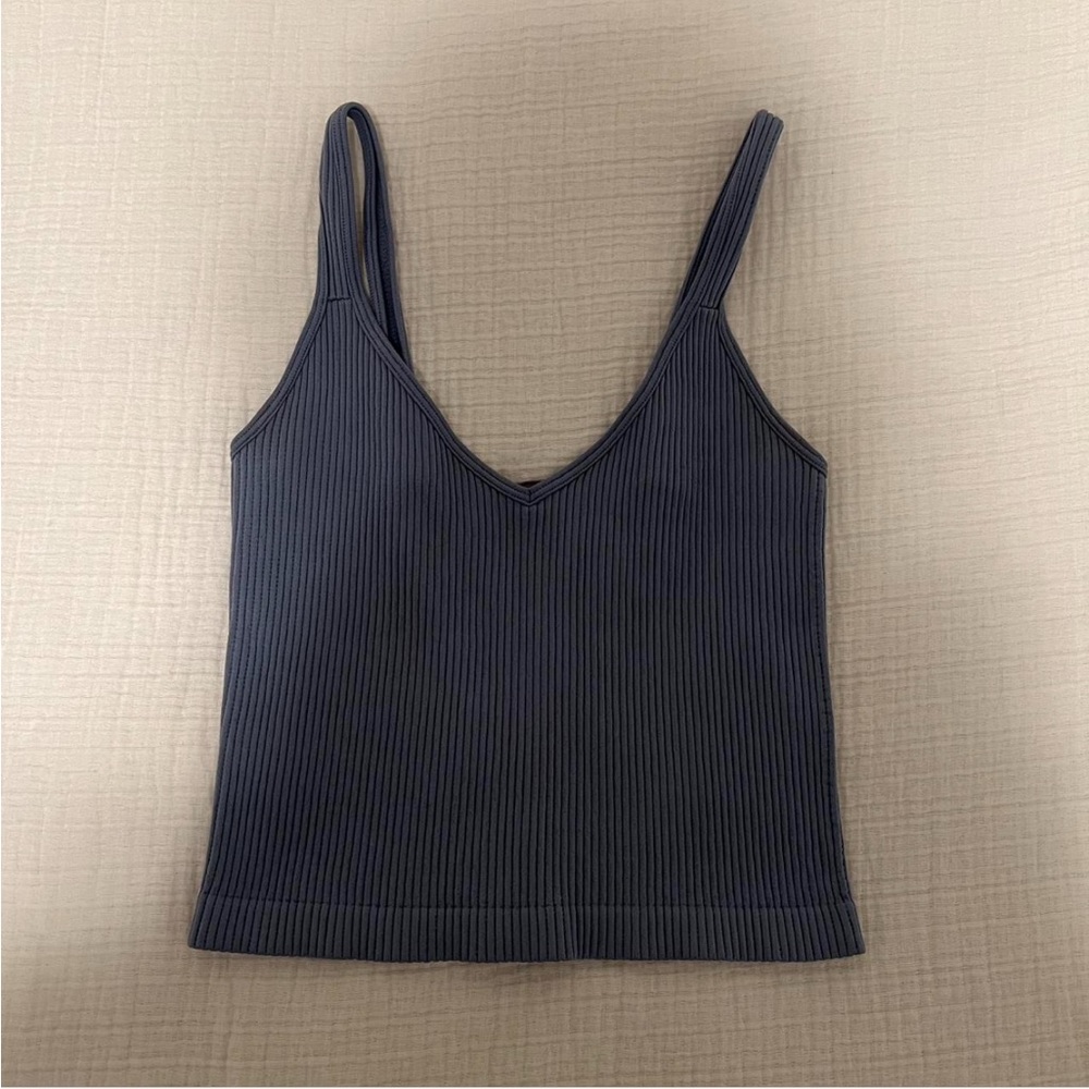 blue ripped tank top from a boutique